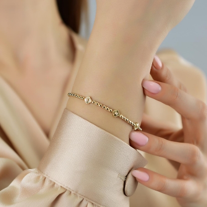 14 Ayar Altın Kalem İşçilikli Yonca Bileklik, 6,77 gram tasarımıyla Altın Bileklik kategorisinde, Goldium imzasıyla modern bir görünüm sunar.